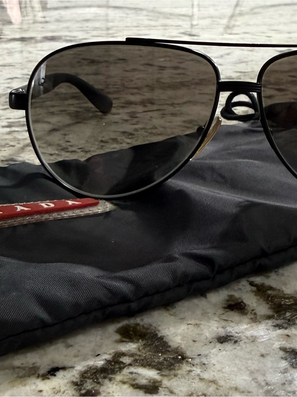 Prada Black Frame Sunglasses with Dark Lenses